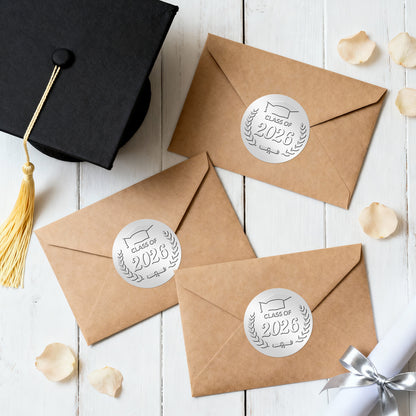 G2PLUS 100Pcs Class of 2026 Stickers - Silver Foil Embossed Graduation Stickers 2 Inch Graduation Cap Envelope Seal Labels for Diplomas Certificates Gradutes Awards Invitation Party Favors